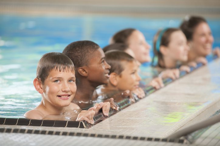 Little Boy Swimming with His Friends